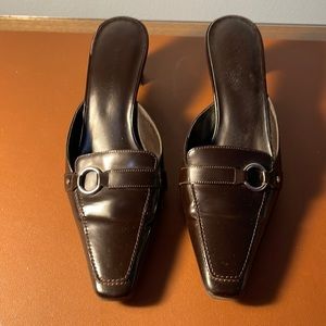 Gently used brown leather slides by Karen Scott